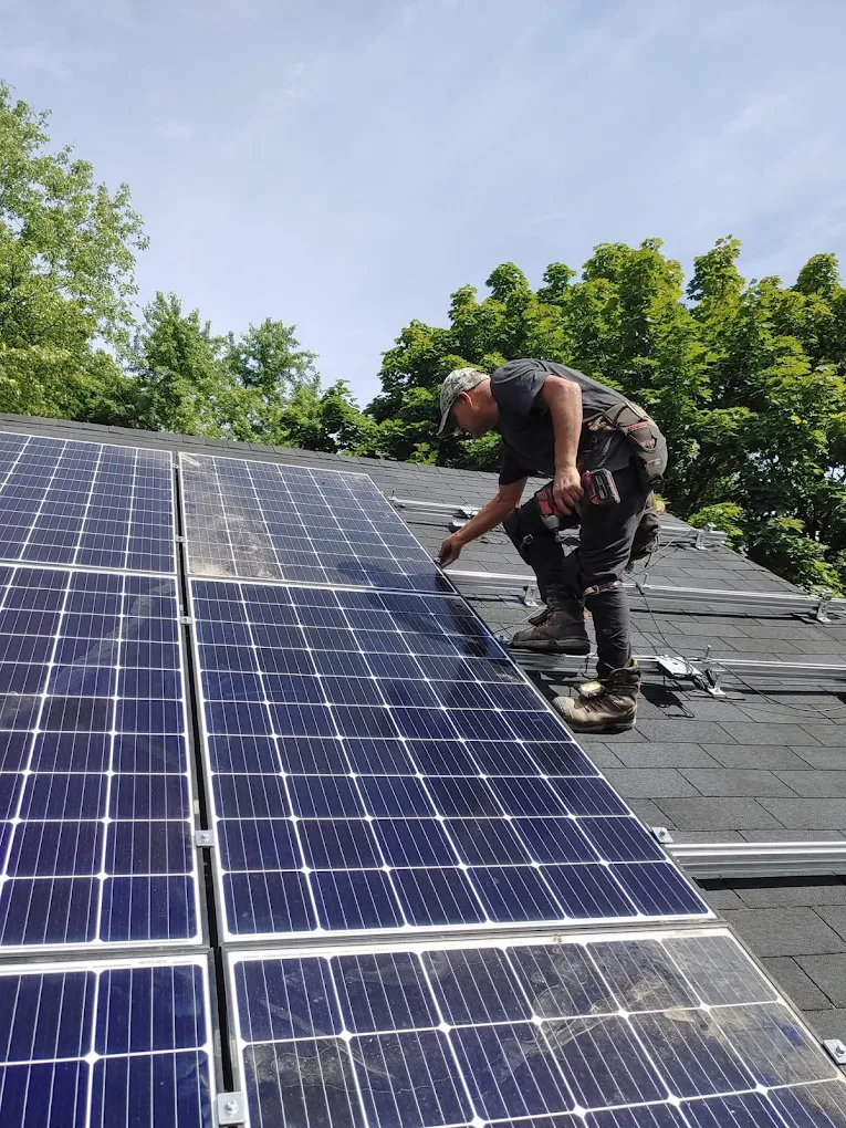 Solar panels being installed on a shingle roof in the GTA